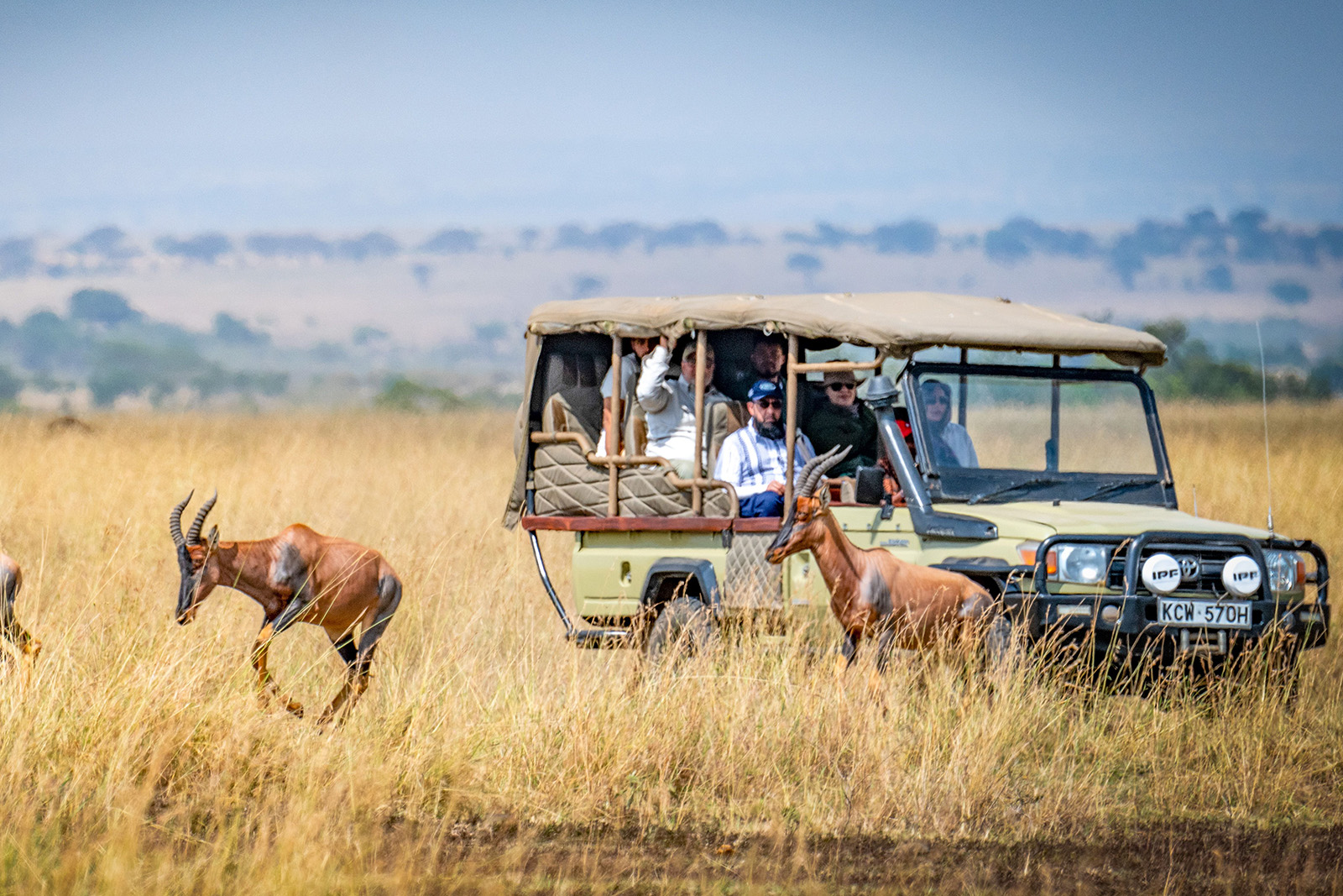 Safari Jeep exploring the open savannah and wildlife landscapes of Amboseli National Park Kenya