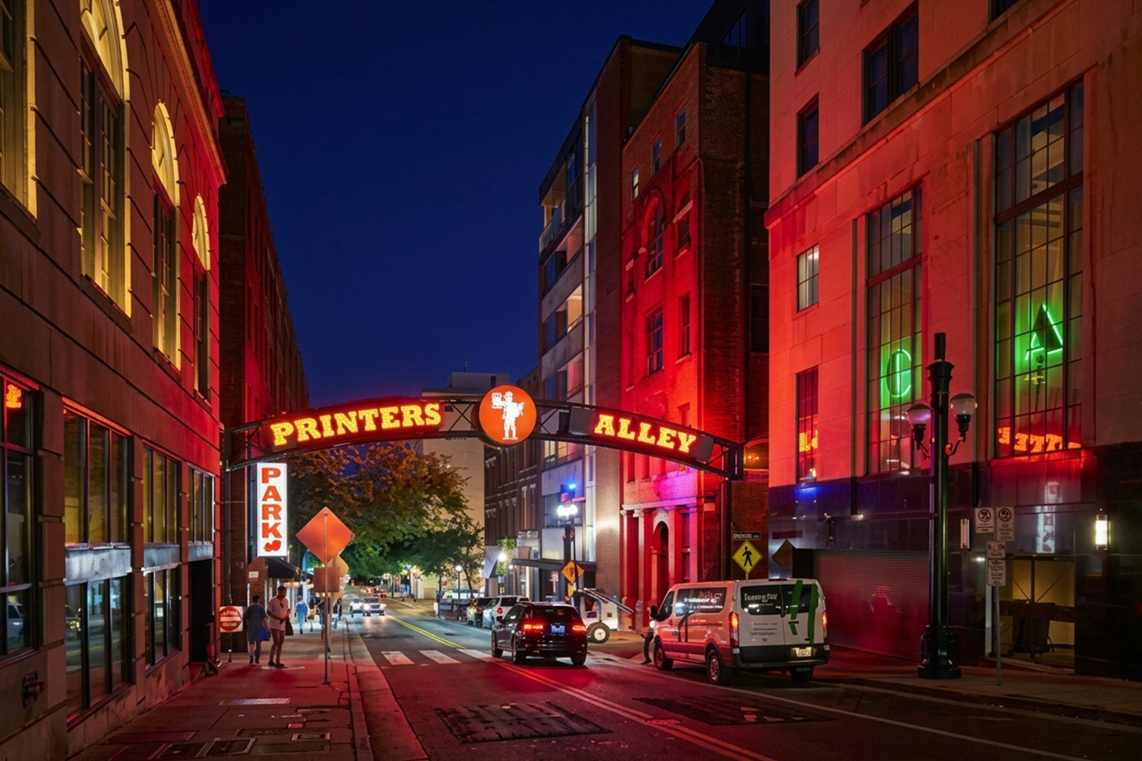 Historic Printers Alley in Nashville Tennessee glowing with colorful neon signs and lively nightlife atmosphere