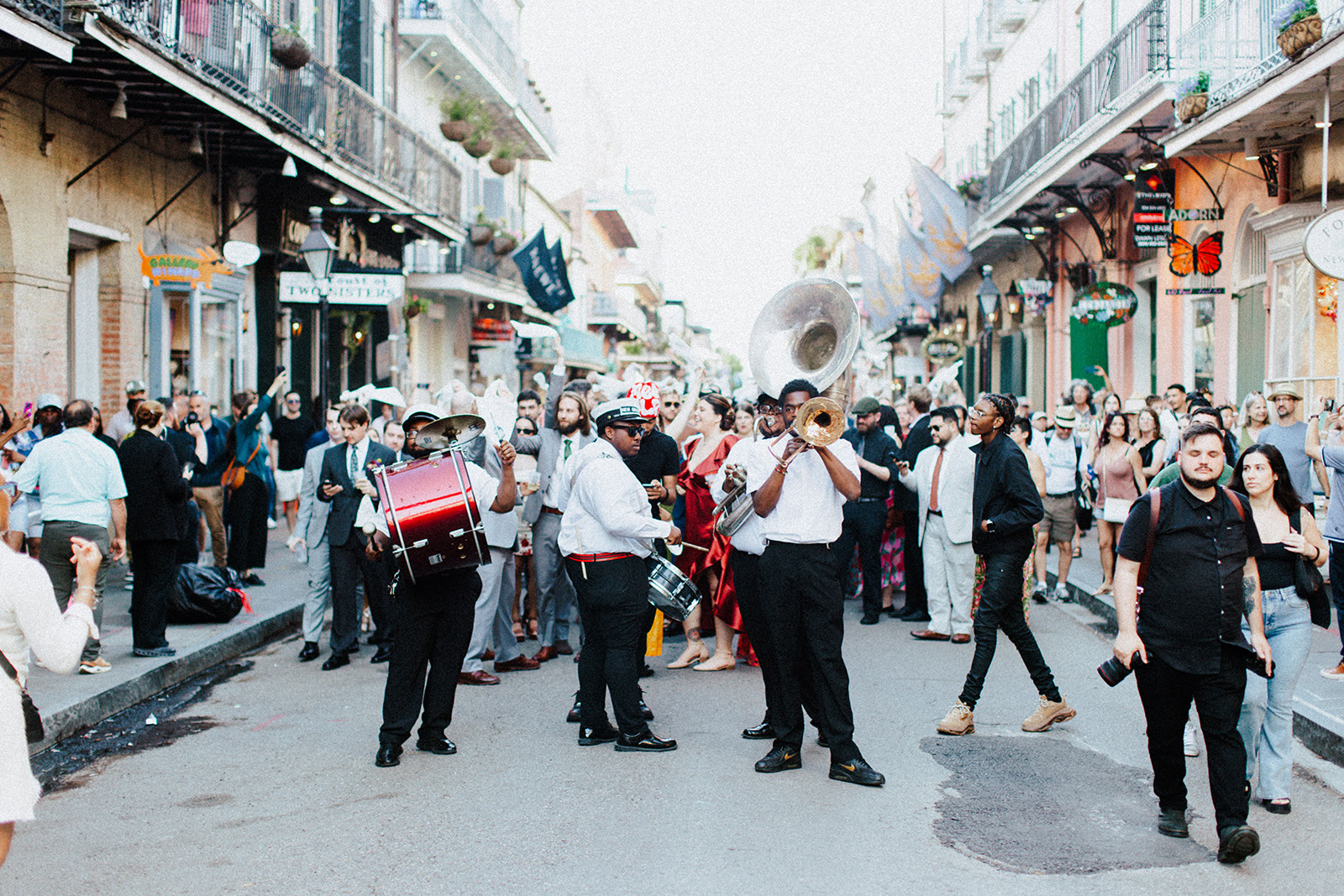 Live New Orleans jazz musicians performing with trumpet saxophone and traditional instruments in a lively music venue