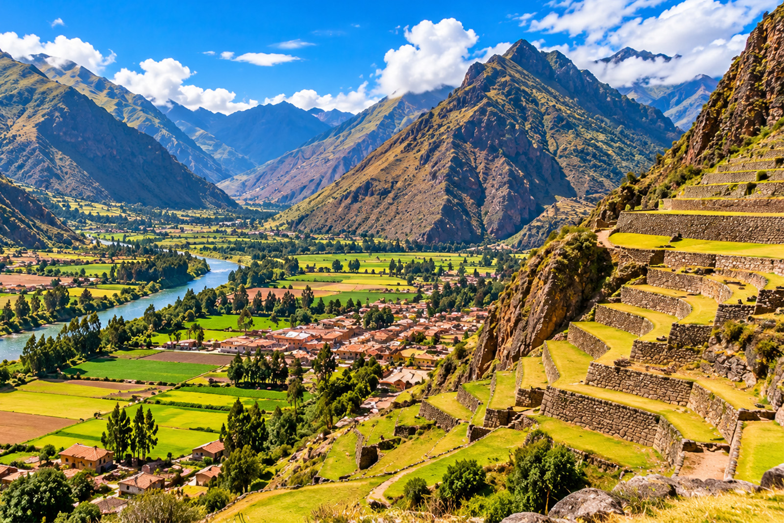 Spectacular Sacred Valley of the Incas in Peru with green agricultural terraces and towering Andes Mountains