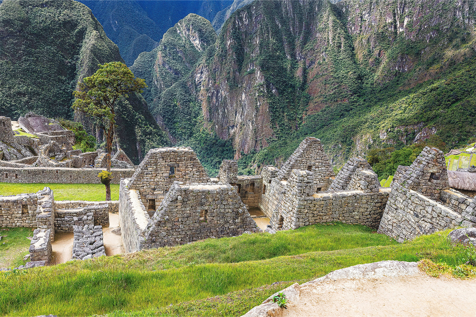 Ancient stone temples and agricultural terraces inside the magnificent Machu Picchu Inca citadel Peru
