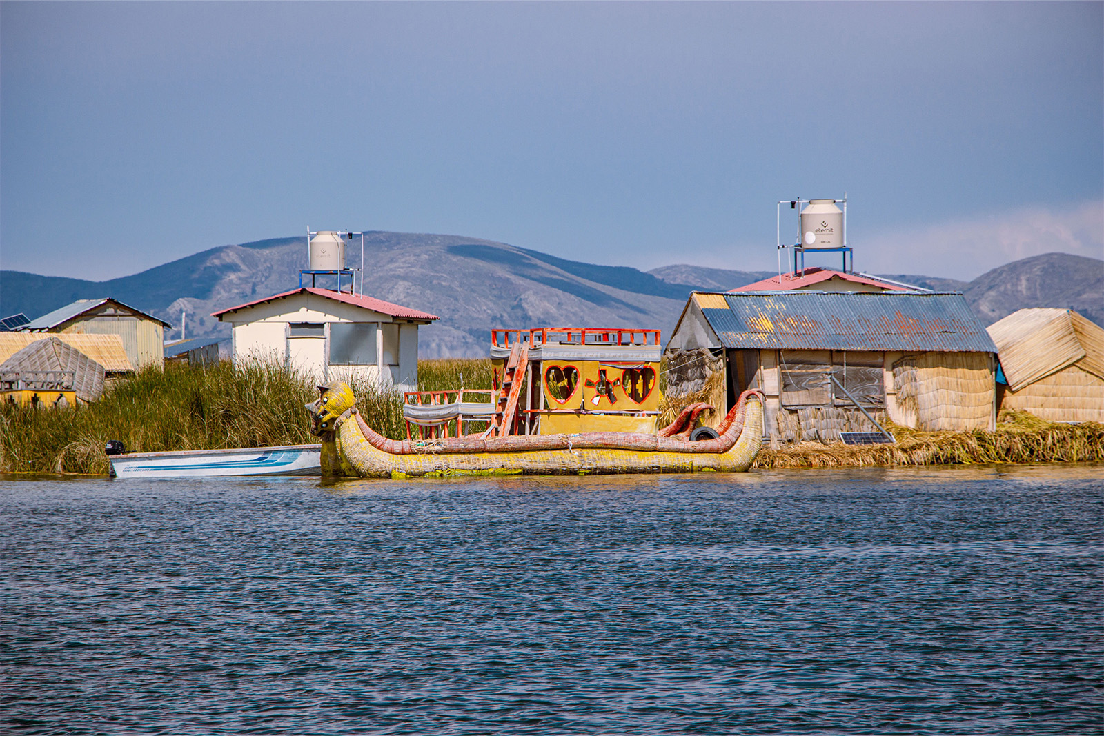 Traditional totora reed floating islands and reed boats of the Uros people on Lake Titicaca Peru