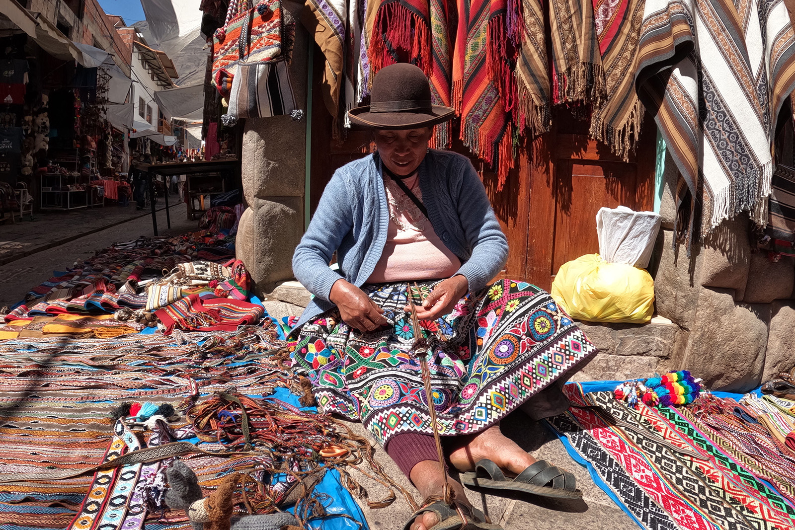 Traditional Andean clothing and colorful handwoven textiles on Taquile Island in Lake Titicaca Peru