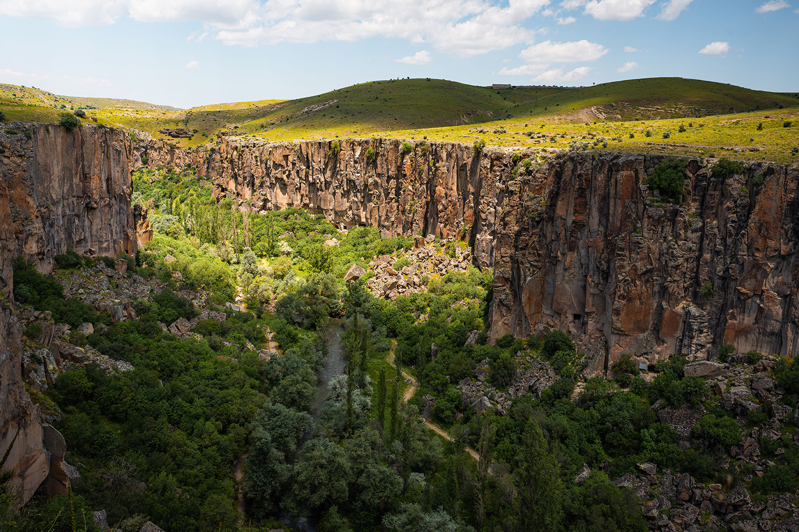 Dramatic volcanic canyon, scenic river and green landscapes in Ihlara Valley Cappadocia Turkey