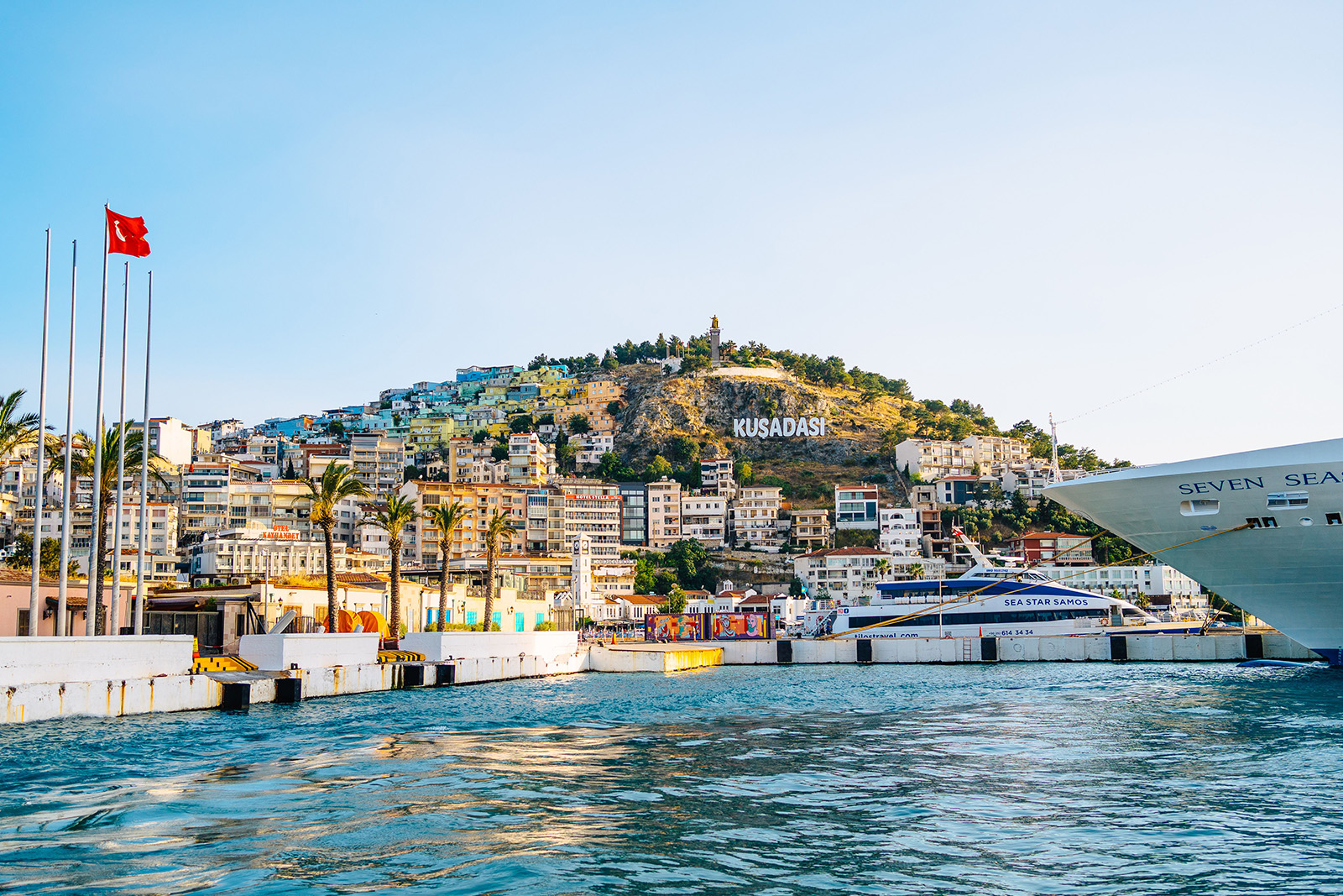 Beautiful Aegean coastline, marina and turquoise sea in Kusadasi Turkey